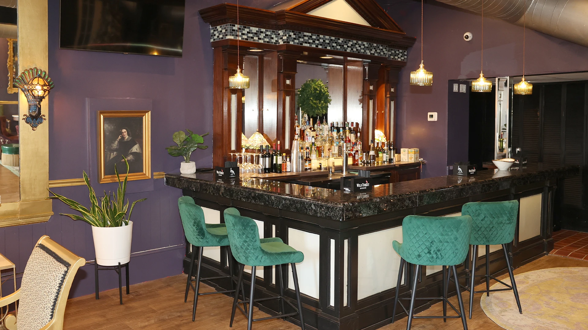 The Toulouse Terrace upstairs bar with velvet seating