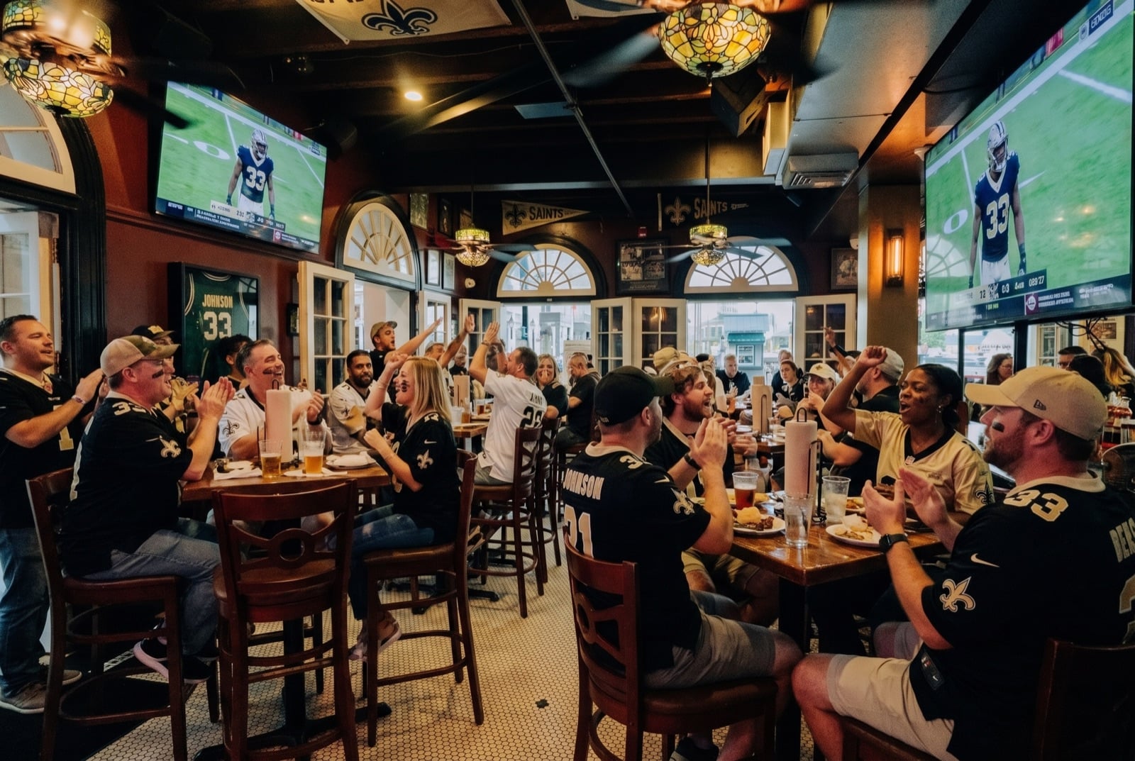 Saints fans cheering at Vieux Sports Saloon on game day