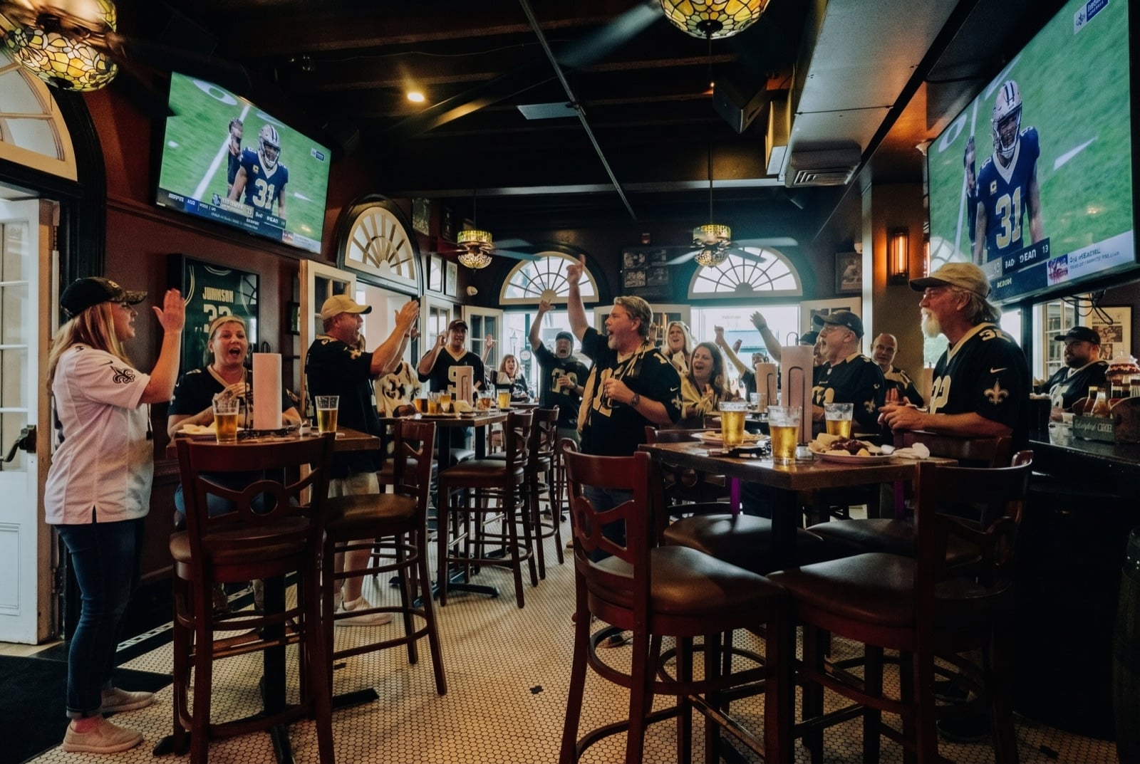 A packed house celebrating a Saints play