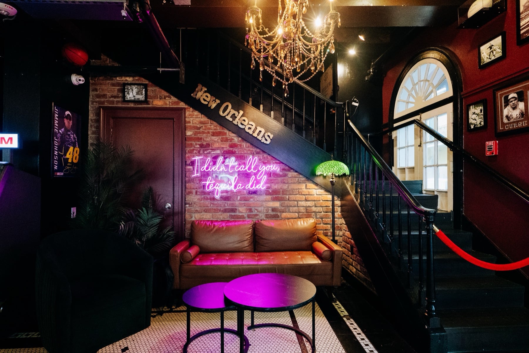 The neon staircase lounge at Vieux Sports Saloon